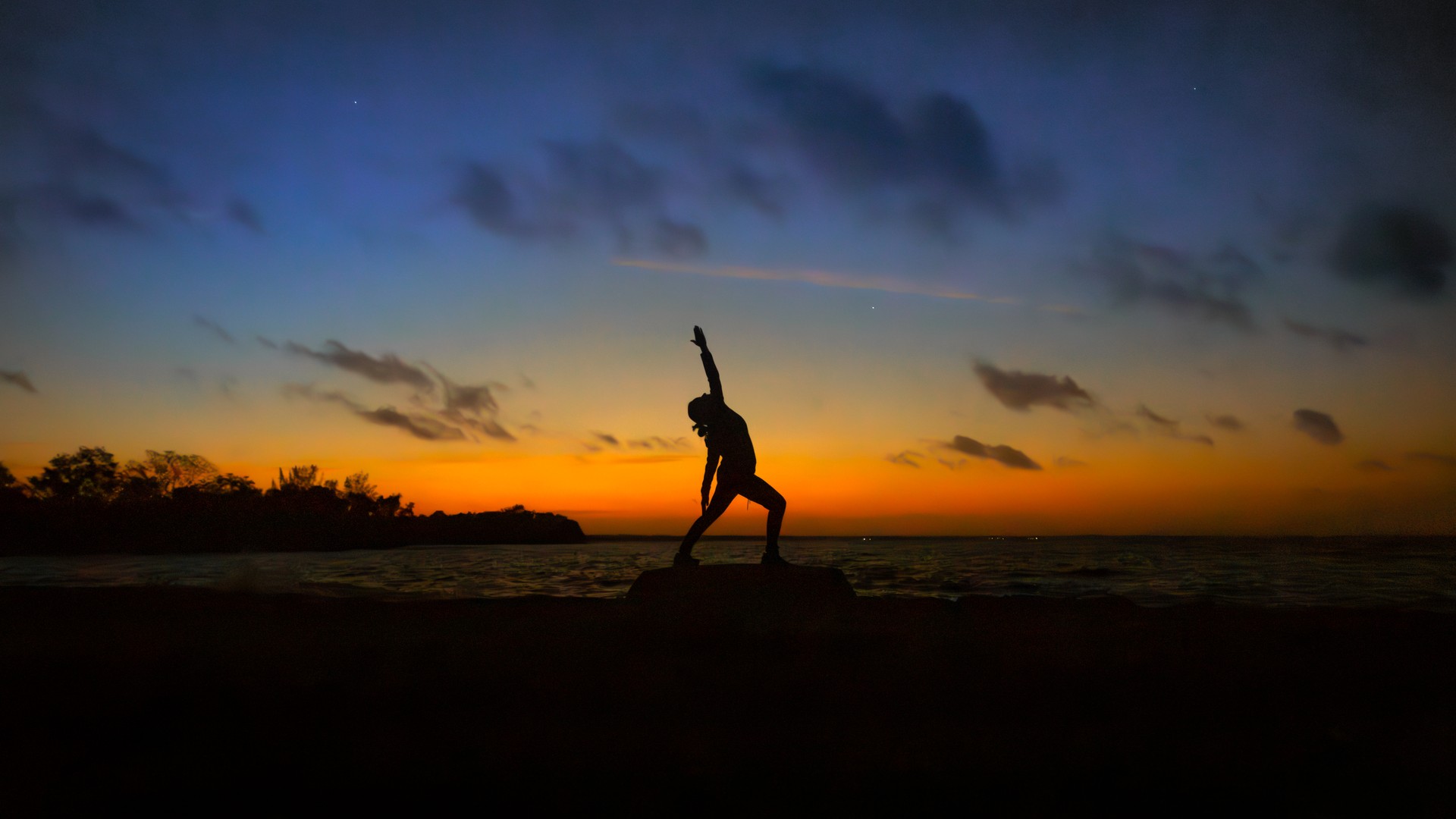 Young woman yoga, meditation, gentle relaxation at sunset.